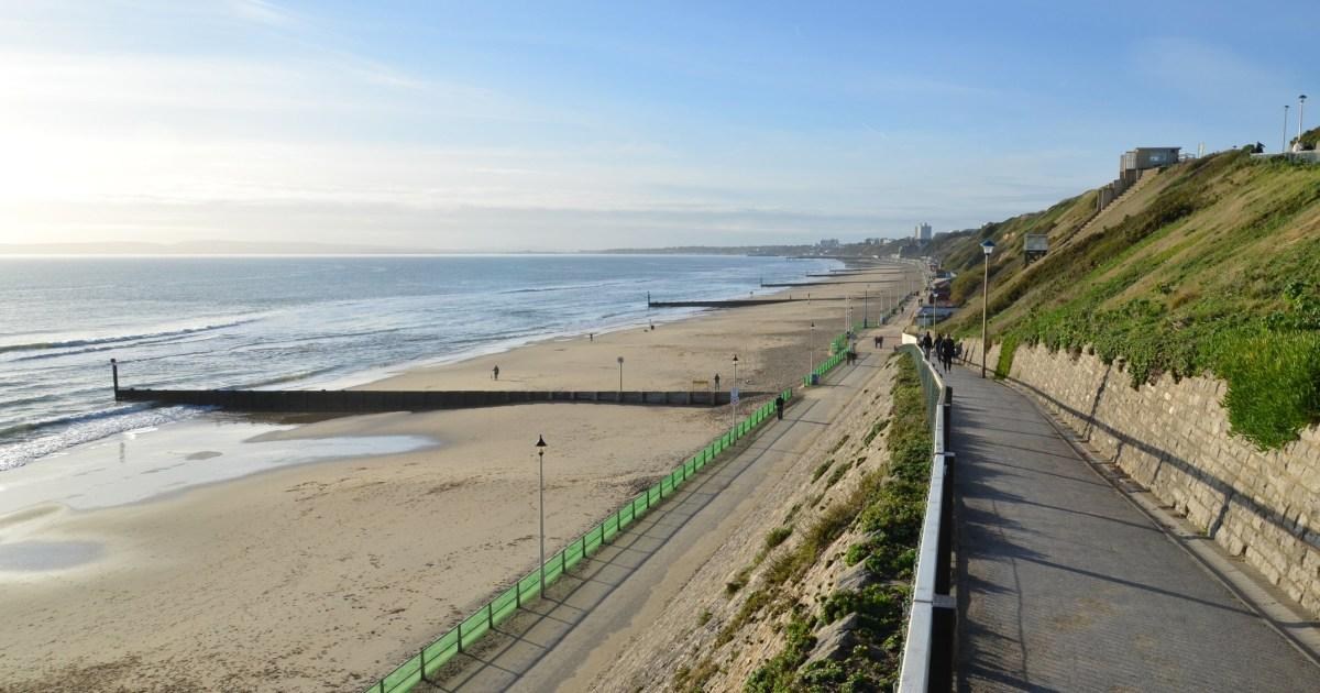 Man dies after falling from 100 ft cliff in front of beachgoers