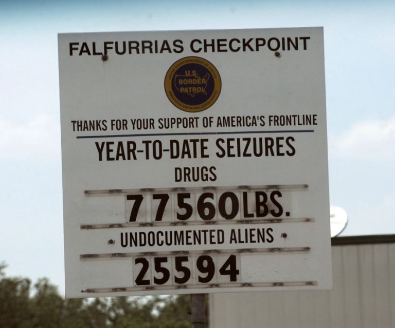 A sign at the Falfurrias Station's U.S. Border Patrol checkpoint about 70 miles north of McAllen, Texas, shows the tally of drugs and illegal immigrants taken by last July. AP Photo