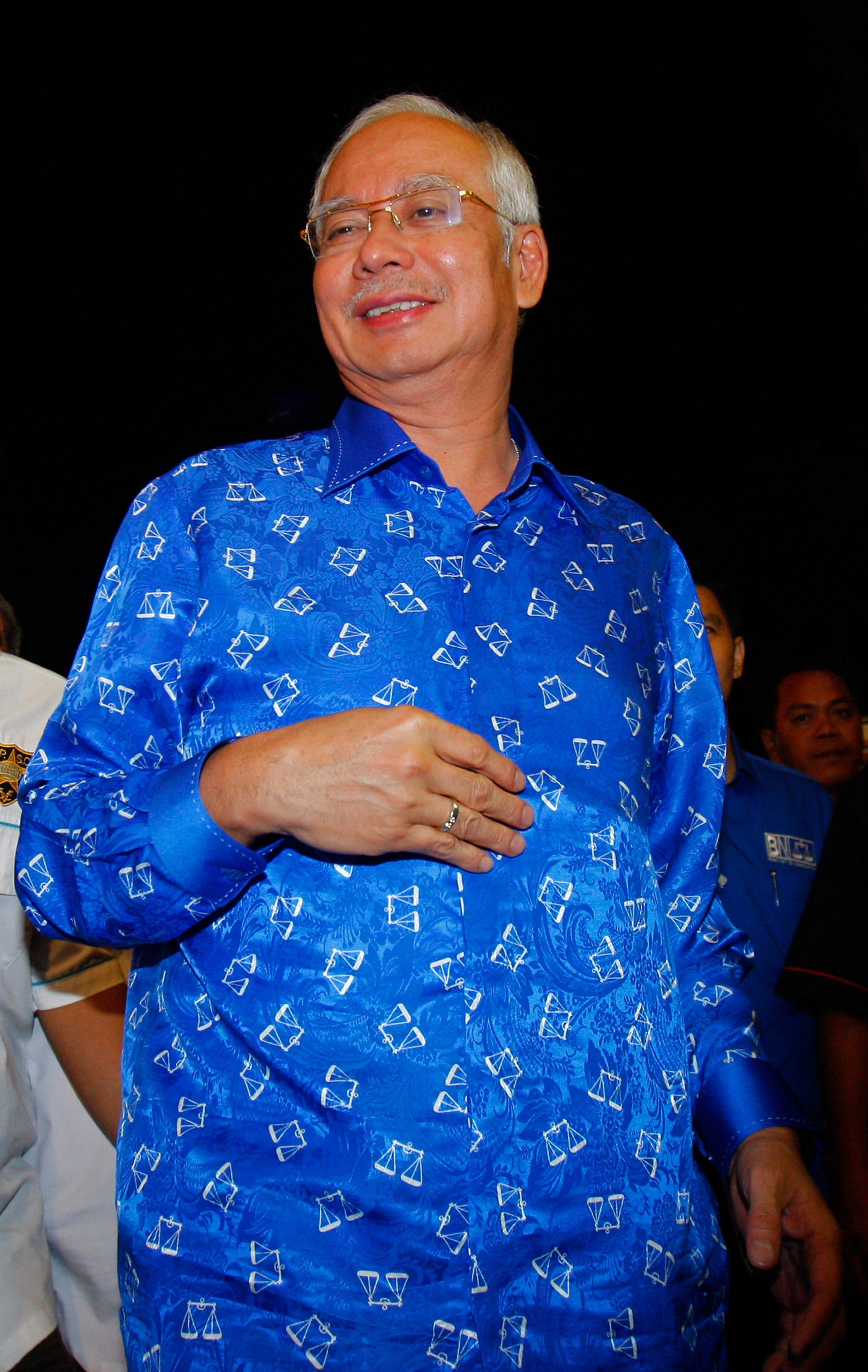 Malaysia’s long-ruling coalition hangs on to power