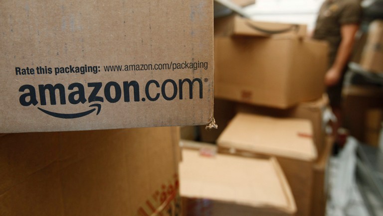 In this Oct. 18, 2010 photo, an Amazon.com package awaits delivery from UPS in Palo Alto, Calif.