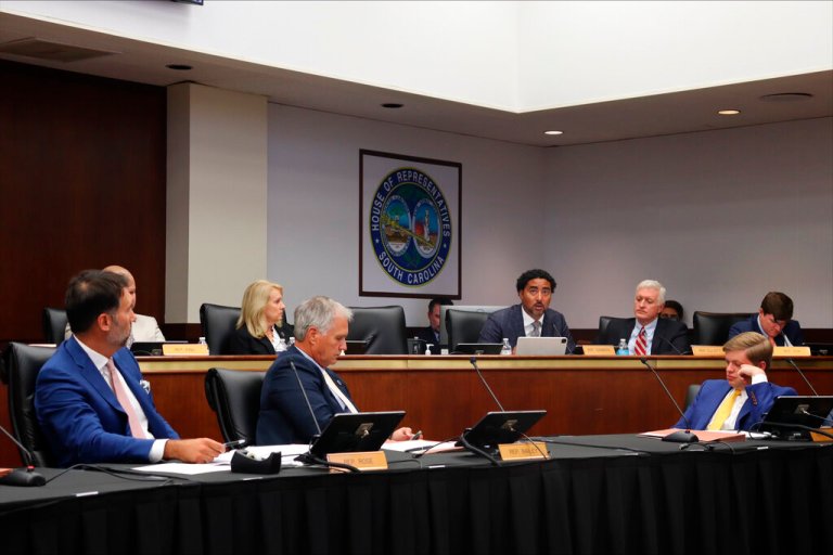 Lawmakers on the South Carolina House Judiciary Committee listen as Rep. Justin Bamberg details his opposition to a proposed abortion ban on Tuesday in Columbia, South Carolina.