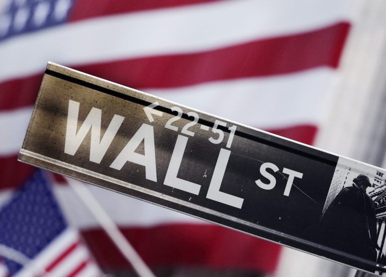 FILE - This Aug. 9, 2011 file photo shows a Wall Street street sign near the New York Stock Exchange, in New York. Global stock markets mostly rose Friday, Aug. 15, 2014 cheered by the prospect of more gains on Wall Street and a sense that Ukraine tensions are easing.  (AP Photo/Mark Lennihan, File)