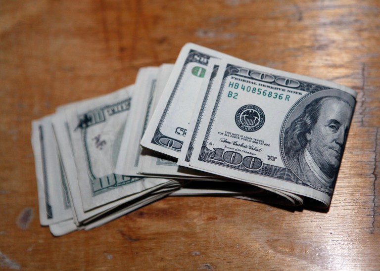 Money on a table.