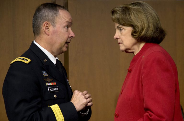 Sen. Dianne Feinstein, D-Calif, chair of the Senate Intelligence Committee, talks with National Security Agency Director General Keith Alexander on Capitol Hill in Washington Sept. 26, 2013, before the start of the Senate Intelligence Committee hearing on the Foreign Intelligence Surveillance Act (FISA), and National Security Agency (NSA) call records. (AP/Carolyn Kaster)