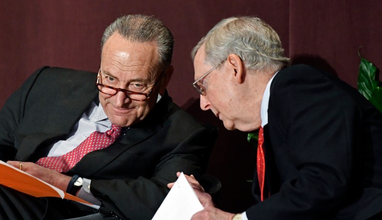 Senate Minority Leader Chuck Schumer, D-N.Y., left, talks with Senate Majority Leader Mitch McConnell, R-Ky., before his speech at the McConnell Center's Distinguished Speaker Series Monday, Feb. 12, 2018, in Louisville, Ky.