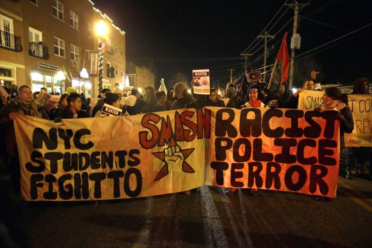 Protesters gather near Ferguson Police Department Friday, Nov. 28, 2014, in Ferguson, Mo. (AP Photo/Jeff Roberson)