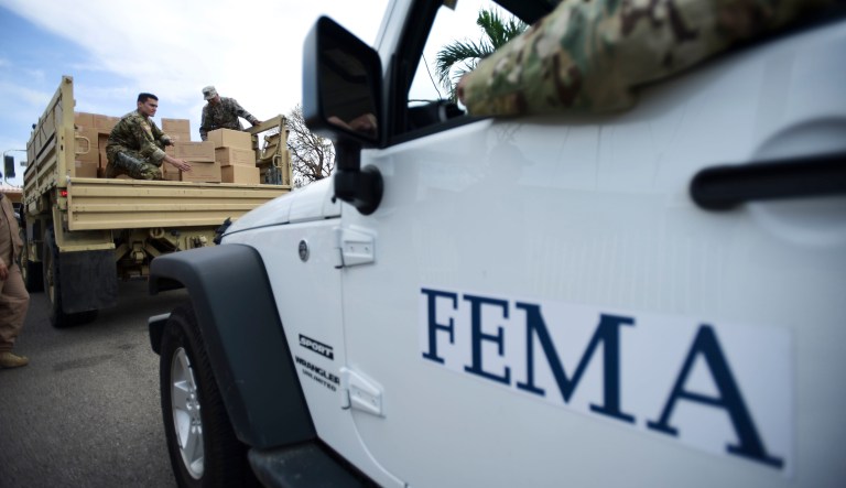 Department of Homeland Security personnel deliver supplies to Santa Ana community residents in the aftermath of Hurricane Maria in Guayama, Puerto Rico, Thursday, Oct. 5, 2017. Even before the storm hit on Sept. 20, Puerto Rico was in dire condition thanks to a decade-long economic recession that had left its infrastructure in a sorry state.