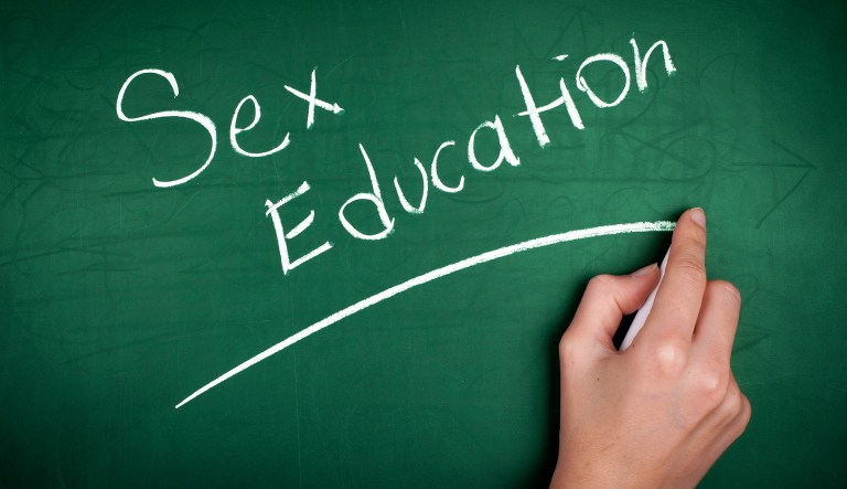 'Sex Education' written in chalk on green blackboard.