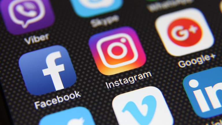 This photo taken May 21, 2016, in Berlin, Germany, shows an Apple iPhone 6s screen with social media applications Facebook, Instagram, Twitter, Google, Youtube, Vimeo, LinkedIn, Pinterest, and WhatsApp.