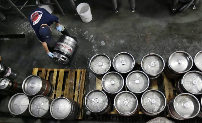 FILE - In this July 1, 2013, file photo, brewer Ken Hermann rolls a fresh keg of beer onto pallets at the Harpoon Brewery in the Seaport District of Boston. The Commerce Department releases its report on business inventories for May 2014 on Tuesday, July 14, 2014. (AP Photo/Charles Krupa, File)