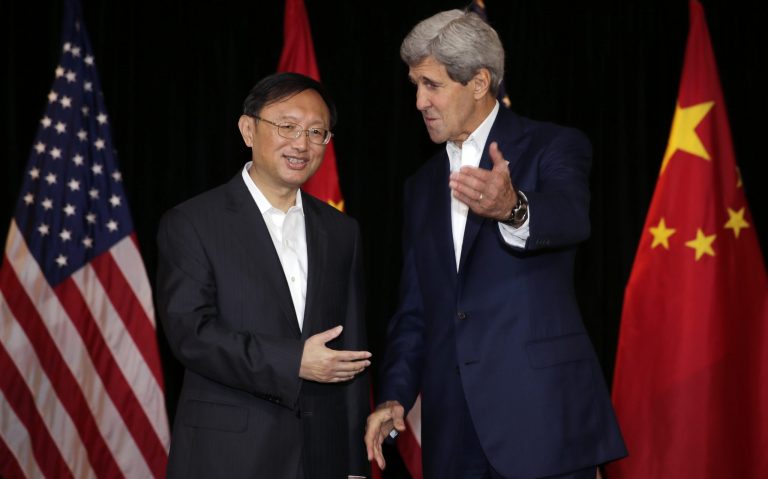 Secretary of State John Kerry, right, talks with Chinese State Councilor Yang Jiechi prior to a meeting in Boston, Saturday Oct. 18, 2014. (AP Photo/Charles Krupa)
