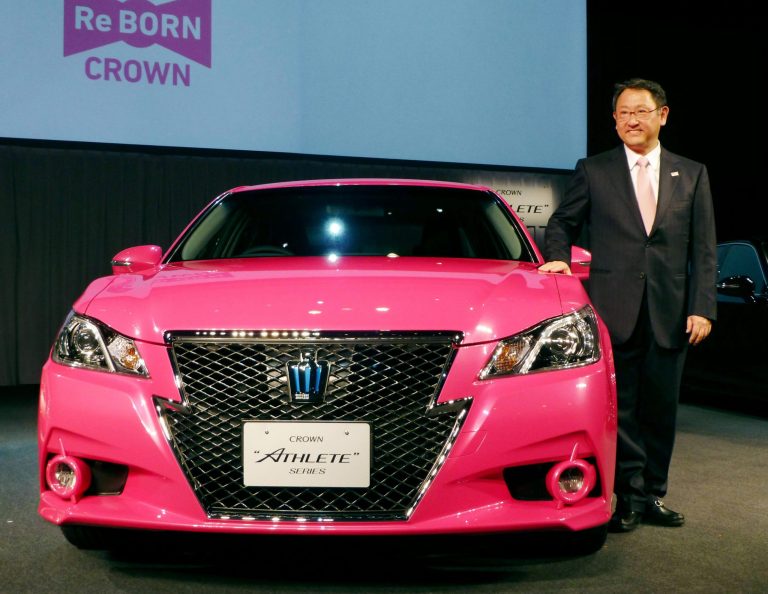   In this Tuesday, Dec. 25, 2012 photo, Toyota Motor Corp. President Akio Toyoda smiles as he shows a remodeled Crown sedan in Tokyo. Toyota expects to sell a record 9.7 million vehicles this year, bouncing back by 22 percent from a disaster-struck 2011. It has set an even higher target of 9.91 million vehicles for 2013. The numbers released this week underline Toyota's solid turnaround from supply disruptions caused by the earthquake and tsunami in northeastern Japan in 2011 that had hurt global production and sales. (AP Photo/Kyodo News) JAPAN OUT, MANDATORY CREDIT, NO LICENSING IN CHINA, HONG KONG, JAPAN, SOUTH KOREA AND FRANCE  