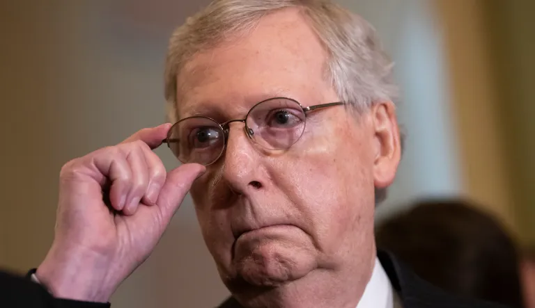 Senate Majority Leader Mitch McConnell, R-Ky., tells reporters he intends to cancel the traditional August recess and keep the Senate in session to deal with backlogged tasks, on Capitol Hill in Washington, Tuesday, June 5, 2018.