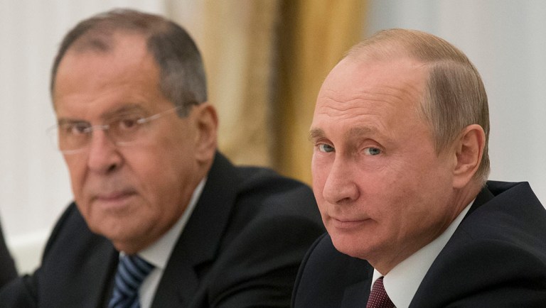 Russian President Vladimir Putin, right, and Russian Foreign Minister Sergey Lavrov attend a meeting at the Kremlin in Moscow, Russia.
