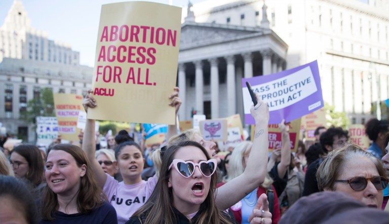 Palmar Kelly of Cocoa Beach, Fla., chants slogans protesting against abortion bans in New York.