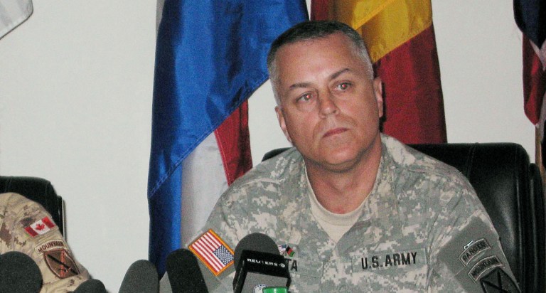 Canadian Brig. Gen. David Fraser, left, and U.S. Brig. Gen. Anthony Tata answer questions from reporters Tuesday, April 4, 2006, in Kandahar, Afghanistan, after announcing an investigation into the possible friendly fire deaths last week of Pte. Robert Costall, 22, and U.S. National Guardsman John Stone, 52. (AP Photo/CP, Murray Brewster)
