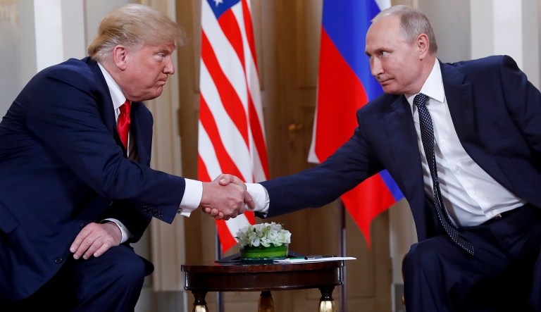 President Donald Trump, left, and Russian President Vladimir Putin, right, shake hand at the beginning of a meeting at the Presidential Palace in Helsinki, Finland, Monday, July 16, 2018. 