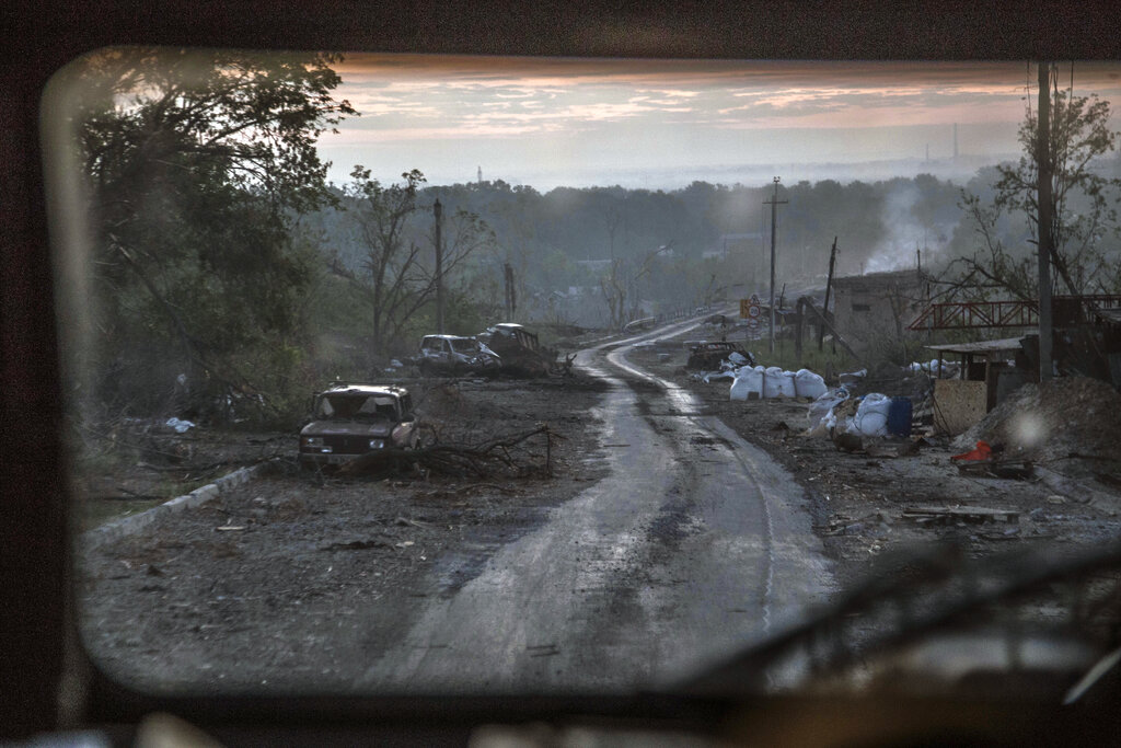 Russian forces destroy all bridges out of besieged Ukrainian city, official says