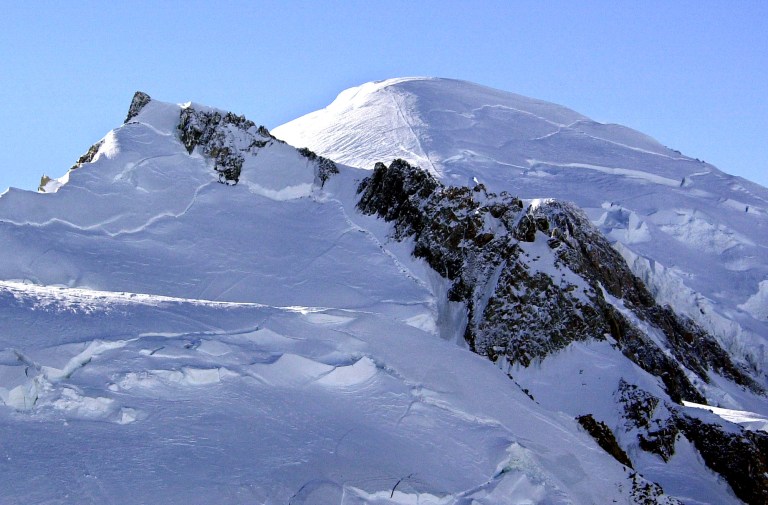 FILE - This Feb. 19, 2003 file photo shows Mont Blanc, western Europe's highest mountain.  A mayor in the French Alps says five climbers have died on Mont Blanc and a sixth is missing. The climbers disappeared overnight as they were trying to reach the Aiguille d'Argentiere, which tops out around 3,900 meters (12,800 feet). Mont Blanc, in addition to its primary peak, contains some 200 summits. The bodies of five climbers were located Wednesday, Aug. 13, 2014, while a sixth has not been found, said Jean-Marc Peillex, mayor of Saint-Gervais, a town at the foot of Europe's tallest mountain. (AP Photo/Patrick Gardin, File)