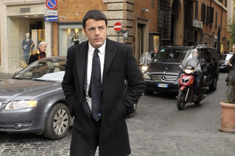 Democratic Party secretary Matteo Renzi arrives at Rome's Parliament house for talks with political party leaders in an effort to form a new coalition, Wednesday, Feb. 19, 2014. Italian President Giorgio Napolitano asked, Monday, Feb. 17,  Renzi to try to form a new government after he managed to oust the previous premier Enrico Letta in a power grab.  (AP Photo/Sub)  ITALY OUT