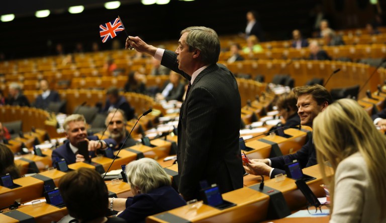 British European Parliament member Nigel Farage waves the Union flag while addressing European lawmakers during the plenary session at the European Parliament in Brussels, Wednesday, Jan. 29, 2020. 