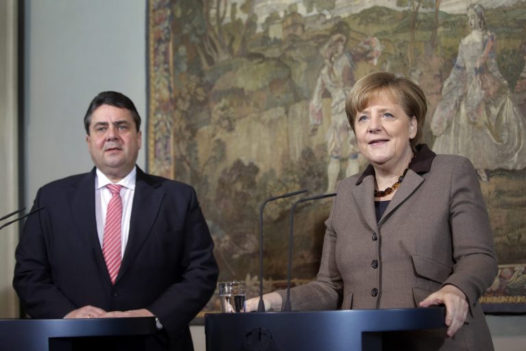 German Chancellor Angela Merkel, right, and German Economy and Energy Minister Sigmar Gabriel, left, address the media during a statement as part of a two day closed meeting of the German Government at the Meseberg palace near Berlin, Germany, Wednesday, Jan. 22, 2014. (AP Photo/Michael Sohn)