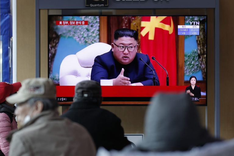 People watch a TV screen showing a news program reporting about North Korean leader Kim Jong Un with a file image at the Seoul Railway Station in Seoul, South Korea, Tuesday, April 21, 2020. The South Korean government is looking into unconfirmed reports saying North Korean leader Kim is in fragile condition after surgery. 