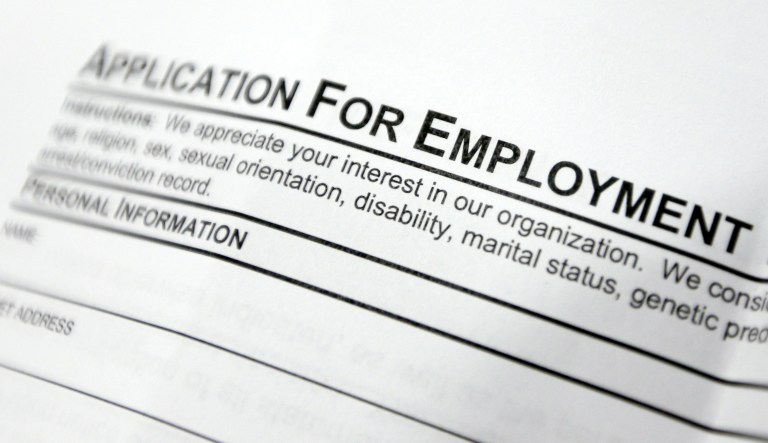This April 22, 2014, file photo shows an employment application form on a table during a job fair at Columbia-Greene Community College in Hudson, N.Y. The Labor Department released its weekly report on applications for unemployment benefits on Thursday, Sept. 1, 2016. Slightly more Americans sought unemployment benefits during the previous week, but the overall levels still remain near historic lows in a positive sign for the job market.