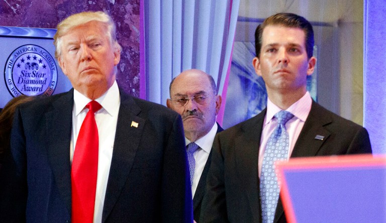 In this Jan. 11, 2017 file photo, Allen Weisselberg, center, stands between then-President-elect Donald Trump, left, and Donald Trump Jr.