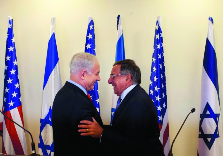 Israeli Prime Minister Benjamin Netanyahu, left, and U.S. Defense Secretary Leon Panetta shake hands during a meeting at the Prime Minister's office in Jerusalem, Wednesday, Aug. 1, 2012. Israel's threats to attack Iran and the violence convulsing Syria top the agenda of Panetta's meetings Wednesday with Israeli government leaders. (AP Photo/Sebastian Scheiner, Pool)