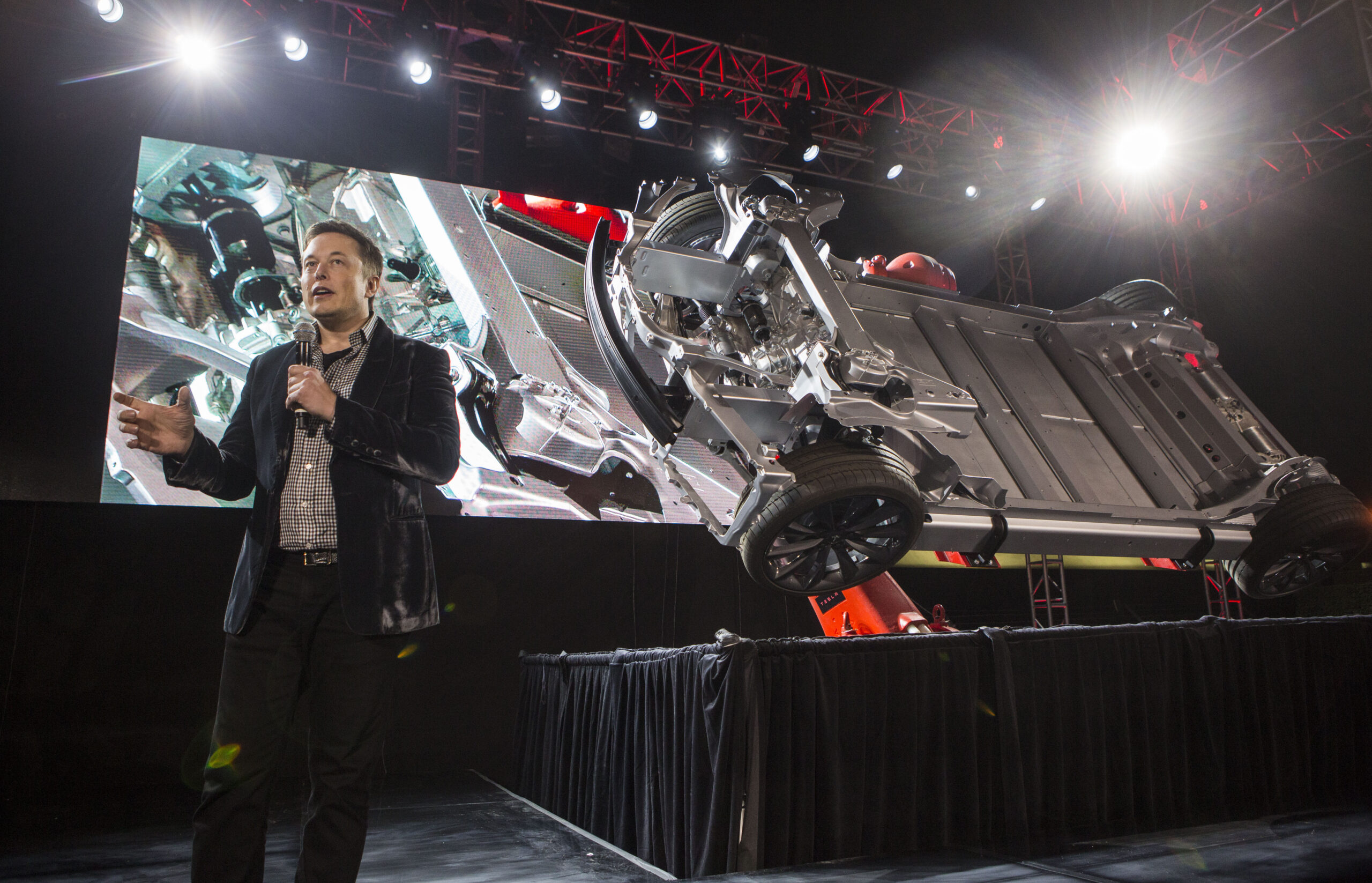 Tesla adding all-wheel drive, safety features
