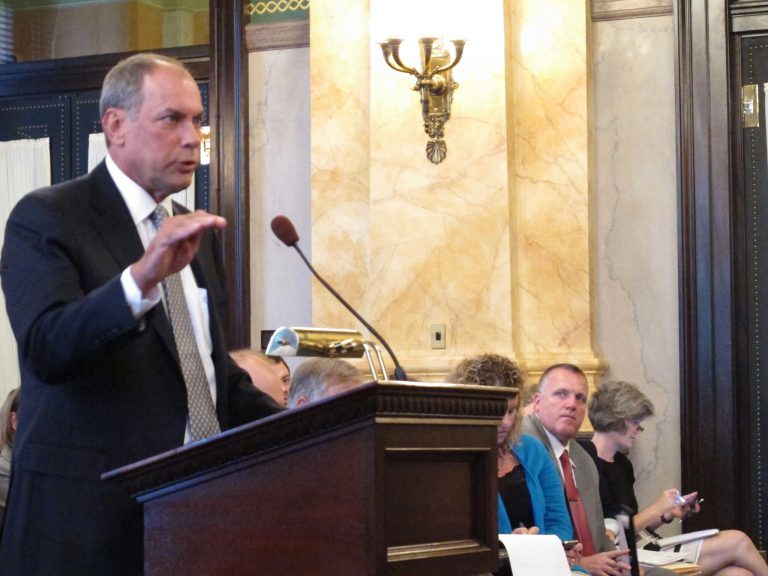 FILE - In this July 30, 2014 file photo, John Hanner, president of Aramark Correctional Services, defends his company's record before a prisons oversight committee in Columbus, Ohio. The private vendor with the contract to feed Ohio prison inmates says it will work with the corrections agency to address several recommendations to fix problems. The state has fined Aramark Correctional Services $272,000 for numerous violations in its year-old contract, including running out of main courses and reports of maggots in food preparation areas. (AP Photo/Andrew Welsh-Huggins, File)