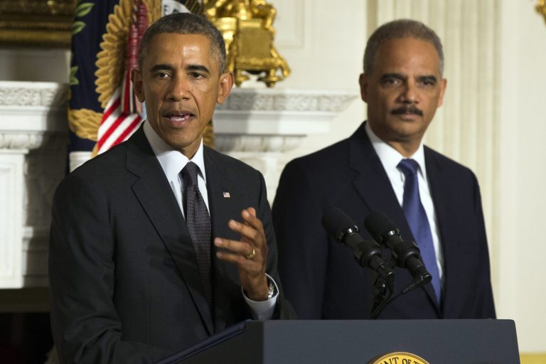 President Barack Obama, accompanied by Attorney General Eric Holder, speaks in the State Dining Room of the White House to announce Holder is resigning, on Thursday, Sept. 25, 2014, in Washington. Holder, who served as the public face of the Obama administration's legal fight against terrorism and weighed in on issues of racial fairness, is resigning after six years on the job. (AP Photo/Evan Vucci)