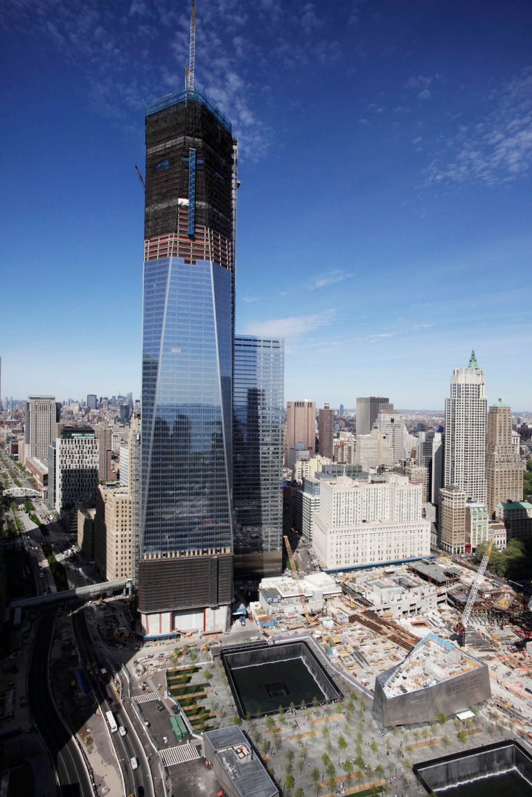   FILE - In this April 17, 2012 file photo, One World Trade Center, rises above the lower New York City skyline as the National September 11 Memorial can be seen at lower right. More than a decade after 9/11, no one's quite sure what to call the spot that was once a smoldering graveyard but is now the site of the fast-rising, 1,776-foot skyscraper that will replace the twin towers. Some are calling the new skyscraper 