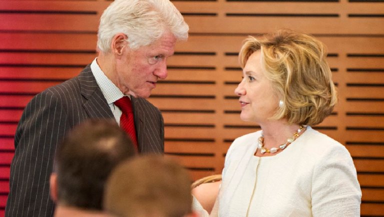 Former President Bill Clinton and Hillary Rodham Clinton attend the Oscar de la Renta: American Icon reception at the William J. Clinton Presidential Center on July 08, 2013 in Little Rock, Arkansas. (Photo by Wesley Hitt/Getty Images)