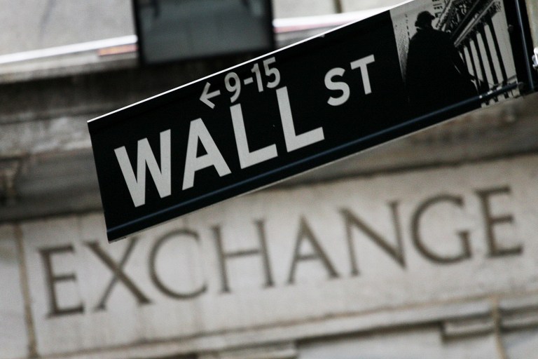FILE - In this Sept. 30, 2008 file photo, a Wall St. sign hangs in front of the New York Stock Exchange. U.S. stocks wavered in morning trading Tuesday, Sept. 2, 2014, as investors looked ahead to major economic reports out this week. (AP Photo/Mark Lennihan, File)