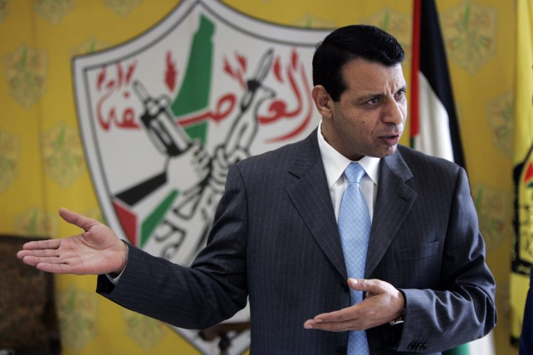 File - In this Jan. 3, 2011 file photo, Palestinian Fatah leader Mohammed Dahlan gestures as he speaks during an interview with The Associated Press in his office in the West Bank city of Ramallah. Banished in 2010 by Palestinian President Mahmoud Abbas, a former mentor, Dahlan has leveraged millions spent on needy Palestinians and his close ties with Egypt and the United Arab Emirates into growing political influence at home. (AP Photo/Majdi Mohammed, File)