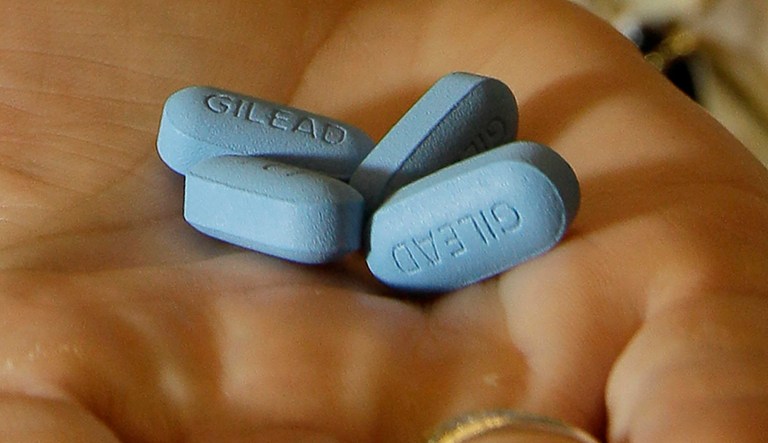In this May 10, 2012, file photo, a doctor holds Truvada pills at her office in San Francisco.