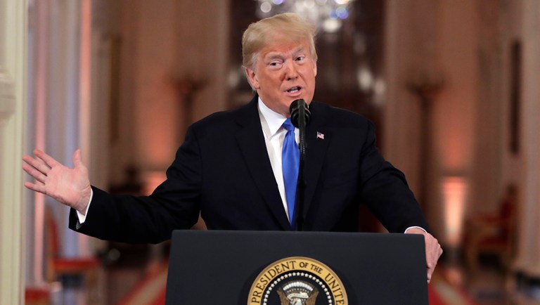 President Trump speaks during a news conference in the East Room of the White House.