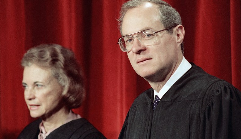 Associate Justice Anthony Kennedy, the newest member of the Supreme Court, and the courts only female member, Justice Sandra Day O'Connor, are shown on Friday, April 15, 1988 in Washington, at the Supreme Court during a picture taking session. The full court was also present for the photo session.