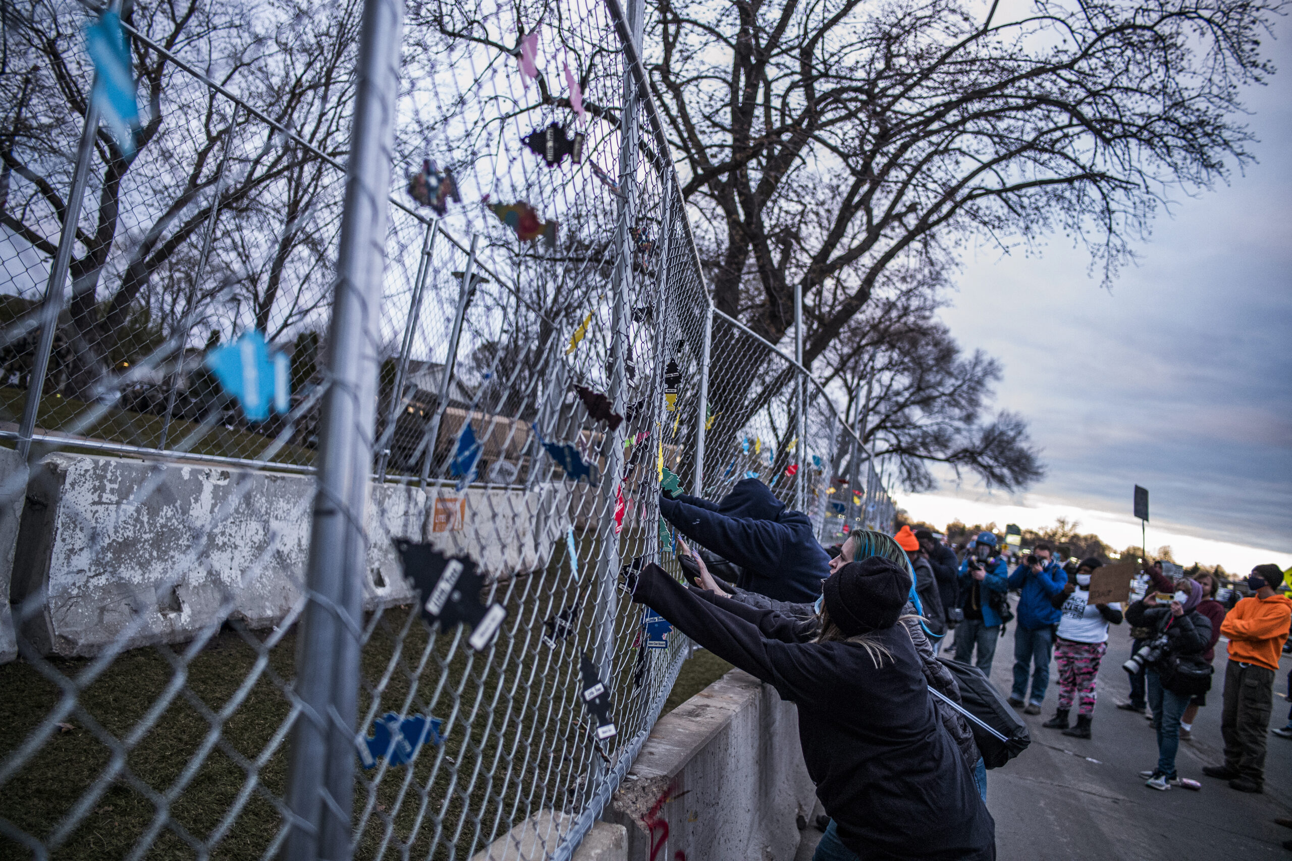 Demonstrators attempt to cut through perimeter fence and hurl objects at officers in another night of Brooklyn Center unrest
