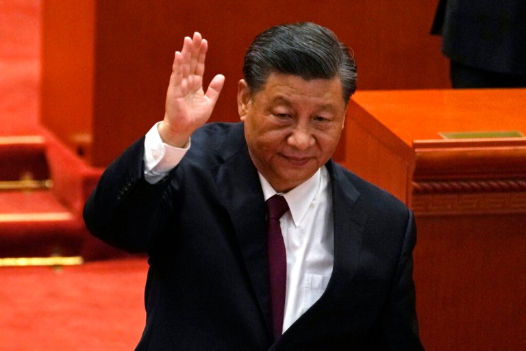 Chinese President Xi Jinping attends a commendation ceremony for role models of the Beijing Winter Olympics and Paralympics at the Great Hall of the People Friday, April 8, 2022, in Beijing. 