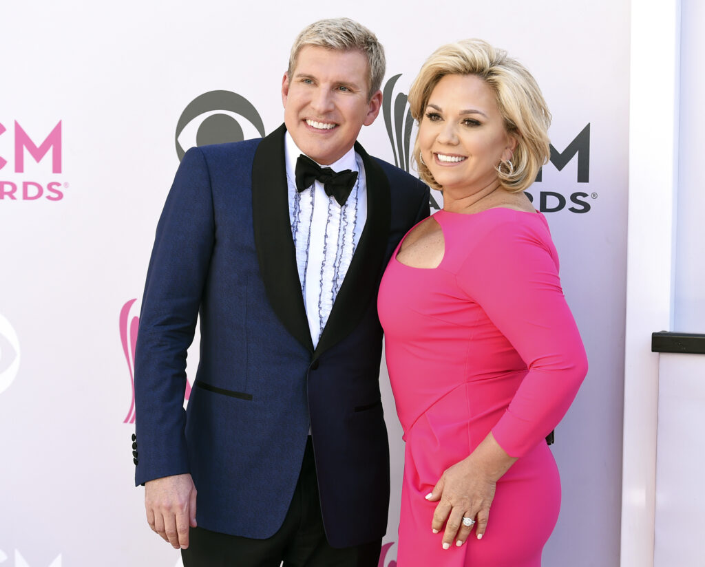 Todd Chrisley, left, and his wife, Julie Chrisley, pose for photos at the 52nd annual Academy of Country Music Awards on April 2, 2017, in Las Vegas.