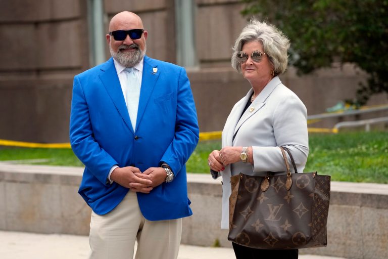 Senior Trump strategists Chris LaCivita and Susie Wiles stand outside after Trump arrived at the E. Barrett Prettyman U.S. Federal Courthouse, Thursday, Aug. 3, 2023, in Washington.