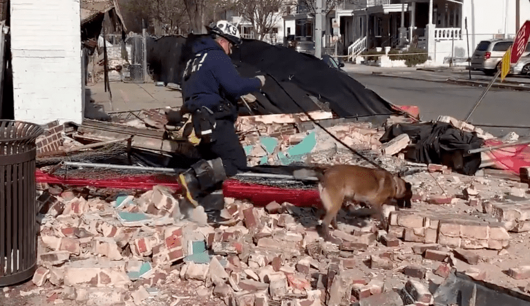 WATCH: Camera captures moment pedestrians narrowly avoid building collapse