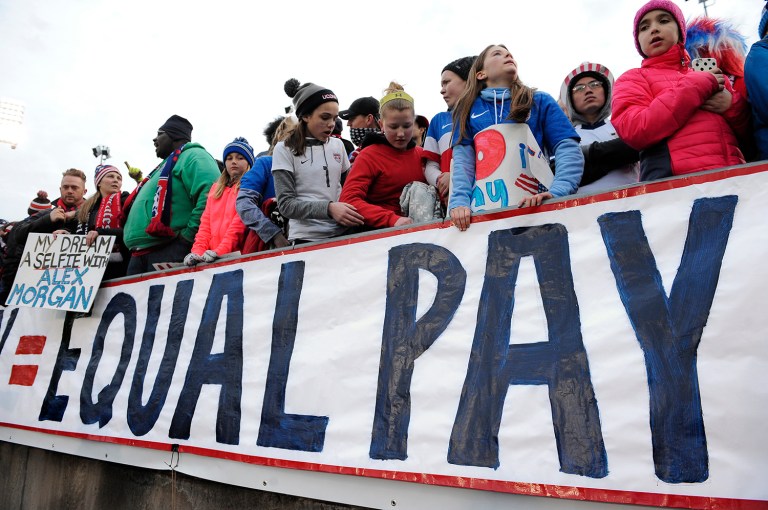 The article gives the impression that women are staying at the office longer but being paid less. In reality, women are working 50 minutes more a day because of unpaid housework. (AP Photo)