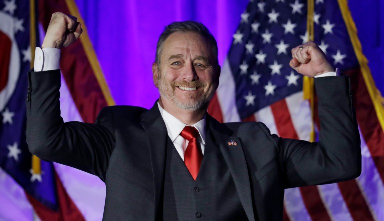 Dave Yost pumps his fists before speaking at the Ohio Republican Party event, Tuesday, Nov. 6, 2018, in Columbus, Ohio. Yost was elected as the next Ohio attorney general.