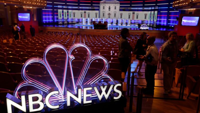 Members of the media gather for a walk-through of the stage set-up for the first democratic debate, Wednesday, June 26, 2019. Ten presidential candidates, led by Sen. Elizabeth Warren, are set to converge on the debate stage on the first night of Democratic debates to offer their pitches to the American people and attempt a breakout moment for their campaigns. 
