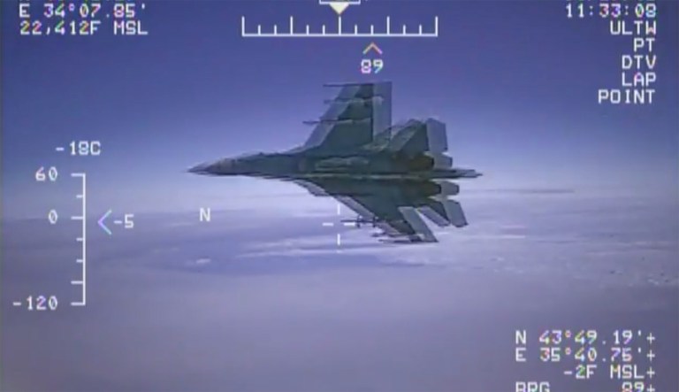 The video shows the Russian jet flying into the American EP-3 Aries aircraft's flight path, causing the EP-3 to have to fly through the Russian plane's jet wash. (Image courtesy screenshot)