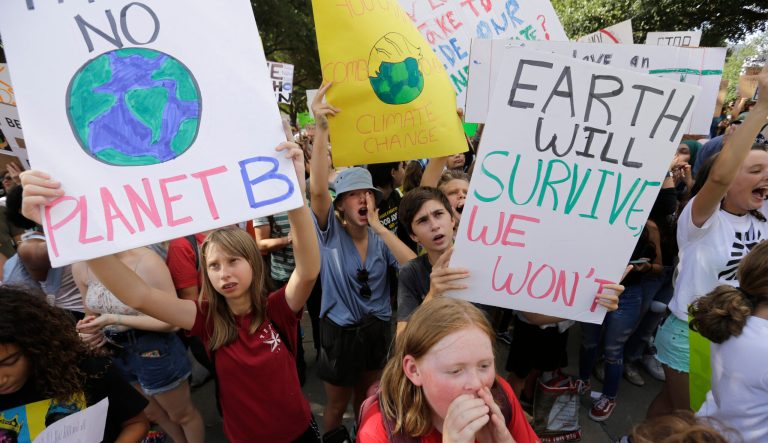 Students chant as they gather for a climate strike rally at the Texas capitol, Friday, Sept. 20, 2019, in Austin, Texas.